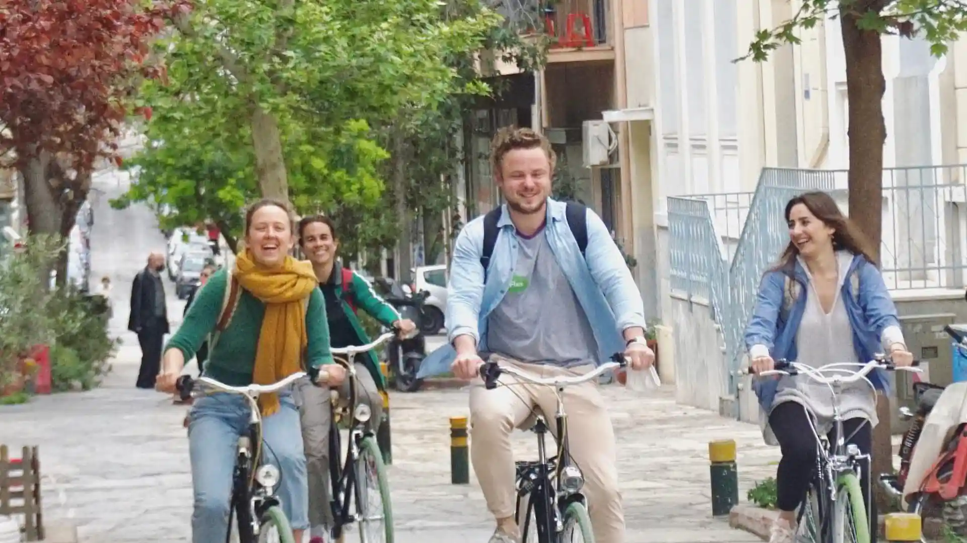 During our Highlights bike tour in English Dutch or German, a group of people enjoys cycling across Athens city center